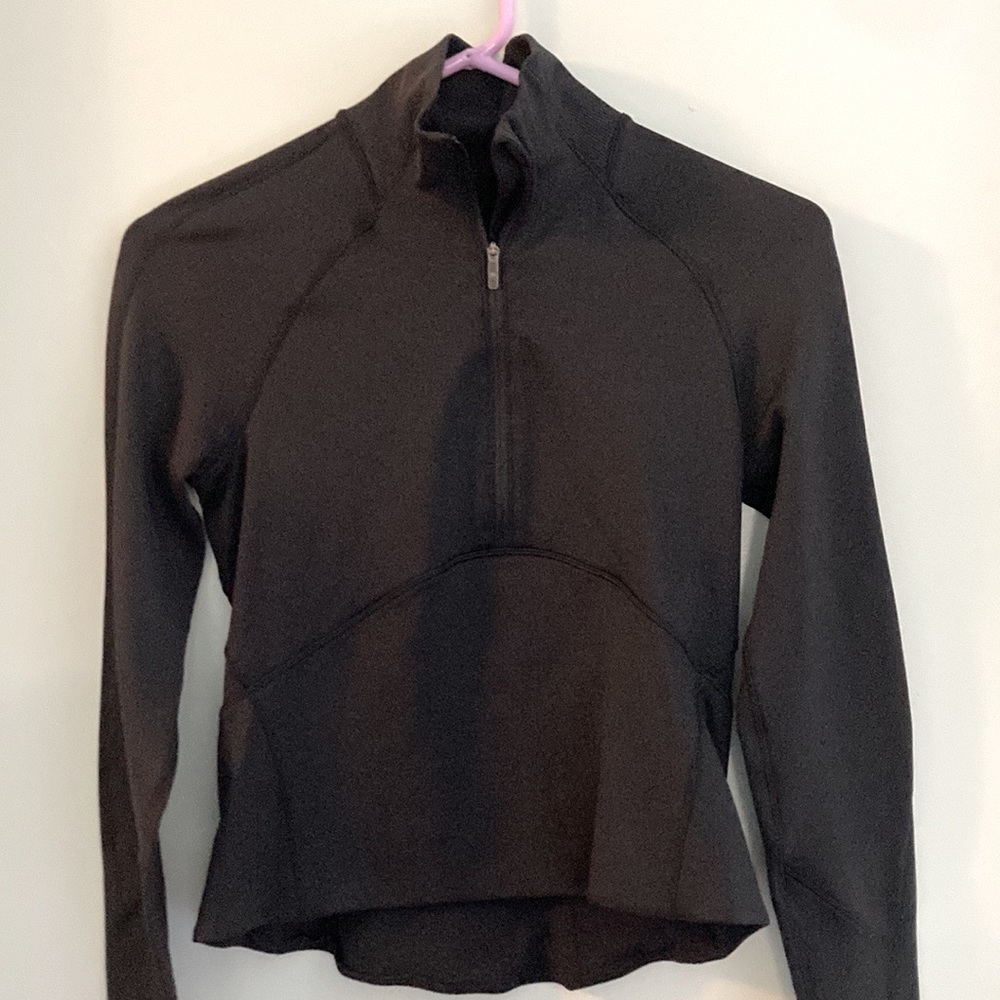 Black lululemon cropped half zip. Only worn twice. Brand new condition.
